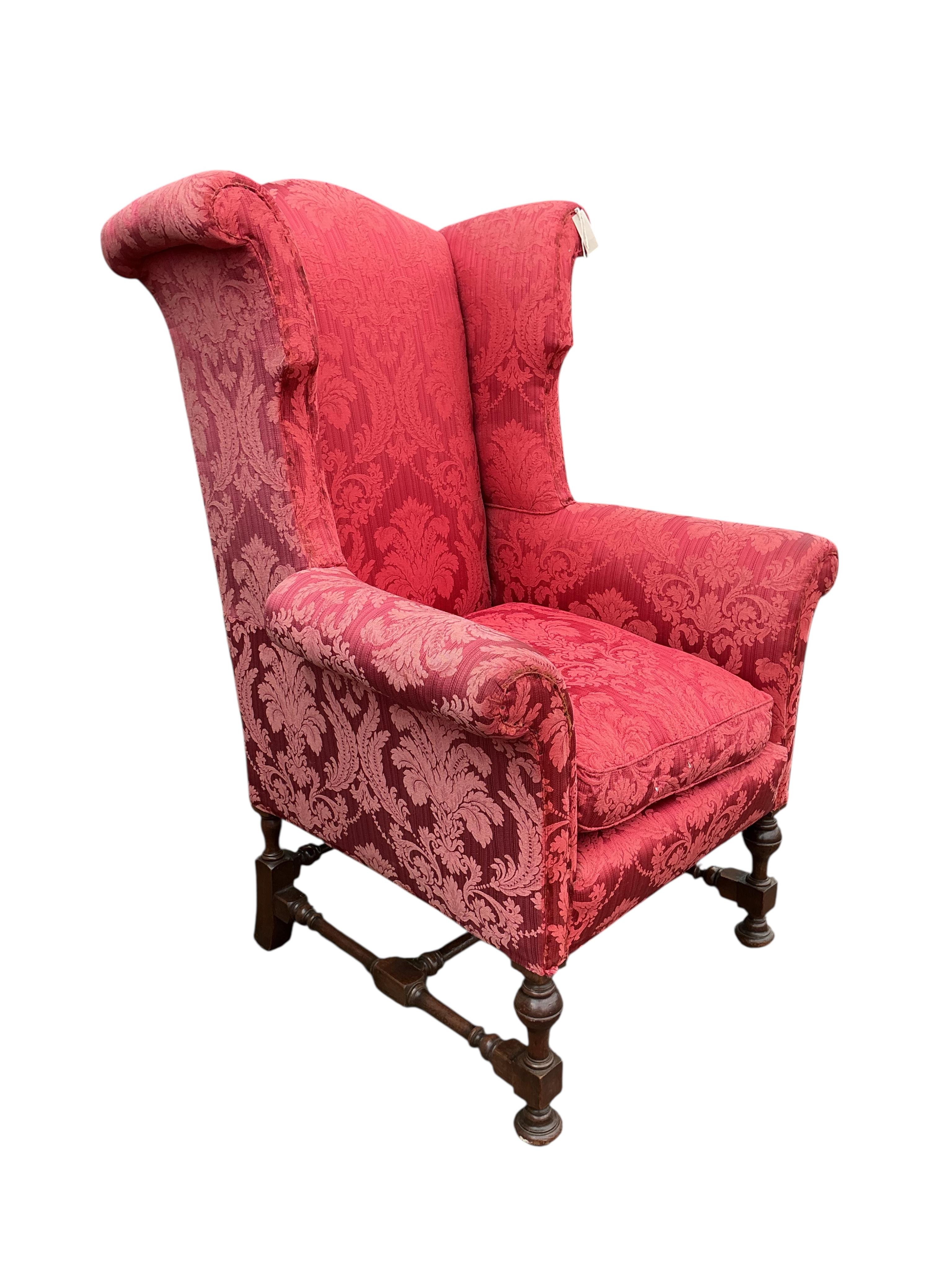 A pair of early 20th century Jacobean Revival upholstered wing armchairs, width 81cm, depth 75cm, height 127cm